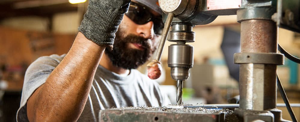 Man Using a Drill Press